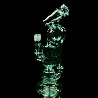 A green glass water pipe with a two-hole percolator and a small attachment at the top, standing against a black background.