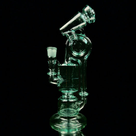 A green glass water pipe with a two-hole percolator and a small attachment at the top, standing against a black background.