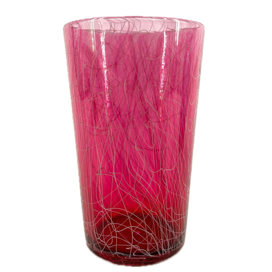 A red glass with a geometric pattern.