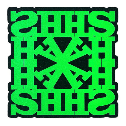 A green square-shaped rug with a geometric pattern and the text 'HASH' repeated across the design.