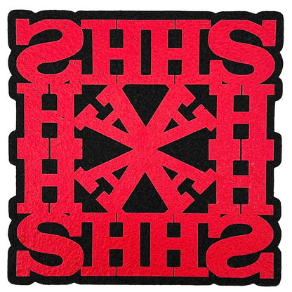 A square red and black moodmat with the text 'HASH' designed by Lot Comedy, featuring a geometric pattern.