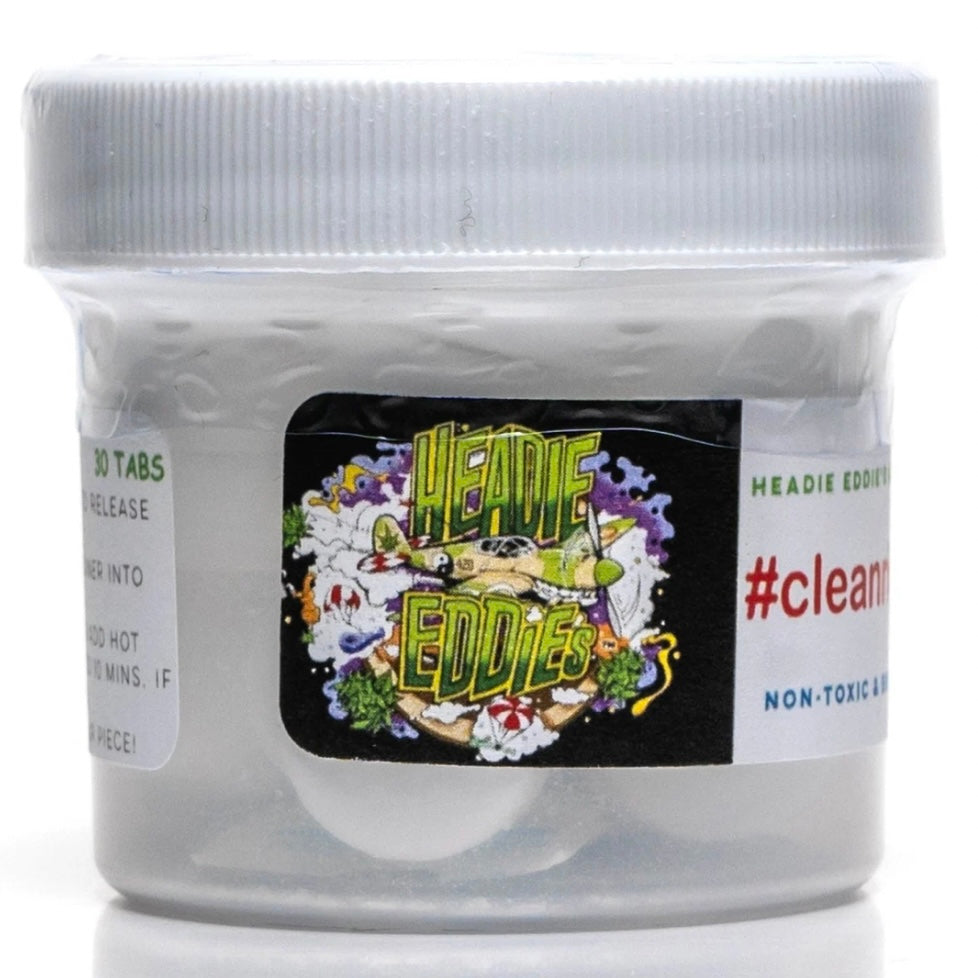 A clear plastic jar containing white cleaning tablets, labeled with 'Headie Eddie's' branding and the text '#clean, 30 tabs', against a white background.