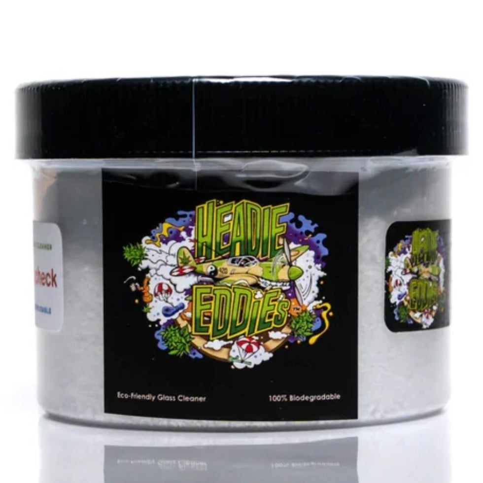 A plastic container of Headie Eddie's glass cleaning powder with colorful label featuring illustrations and text.