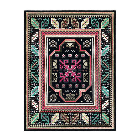 A rectangular 'High Roller Bitrug' mood mat with a geometric pattern featuring a central pink and black design, created with upcycled scraps.