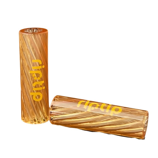 Two cylindrical glass tips with 'Gordo' branding, designed for smoking, with a yellowish tint and textured surface.