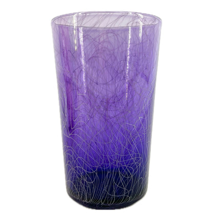 A purple glass with a swirling white pattern, crafted by Xander D’Ambrosio.