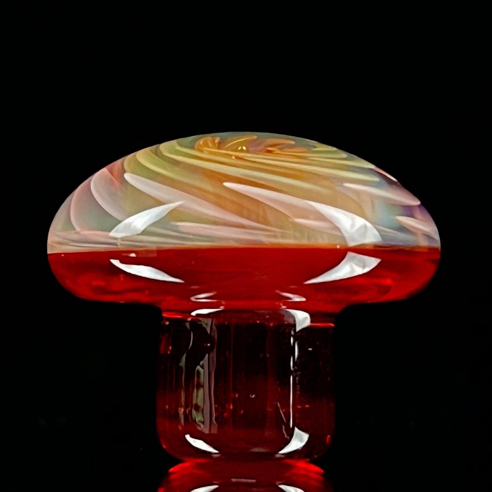 A set of three Phase Glass pieces with a swirling multicolor design, including a cap plug, valve marble, and pillar.