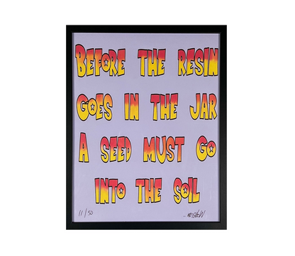 Framed artwork with colorful text on a light purple background.