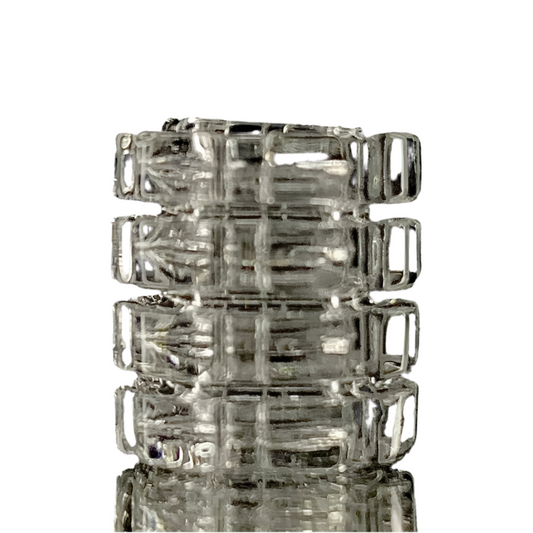 A stack of clear glass gear-shaped inserts, likely made from quartz, with visible internal threading and external ridges.