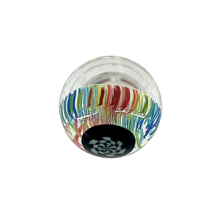 Glass marble with colorful striped pattern on a white background.