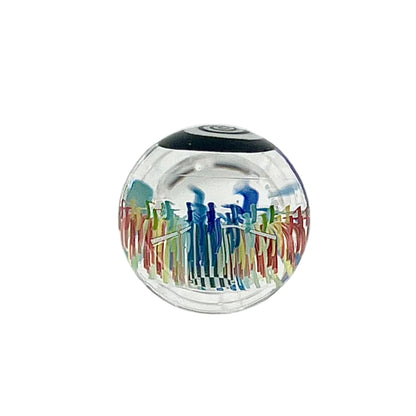 Glass sphere with colorful lines on a white background.