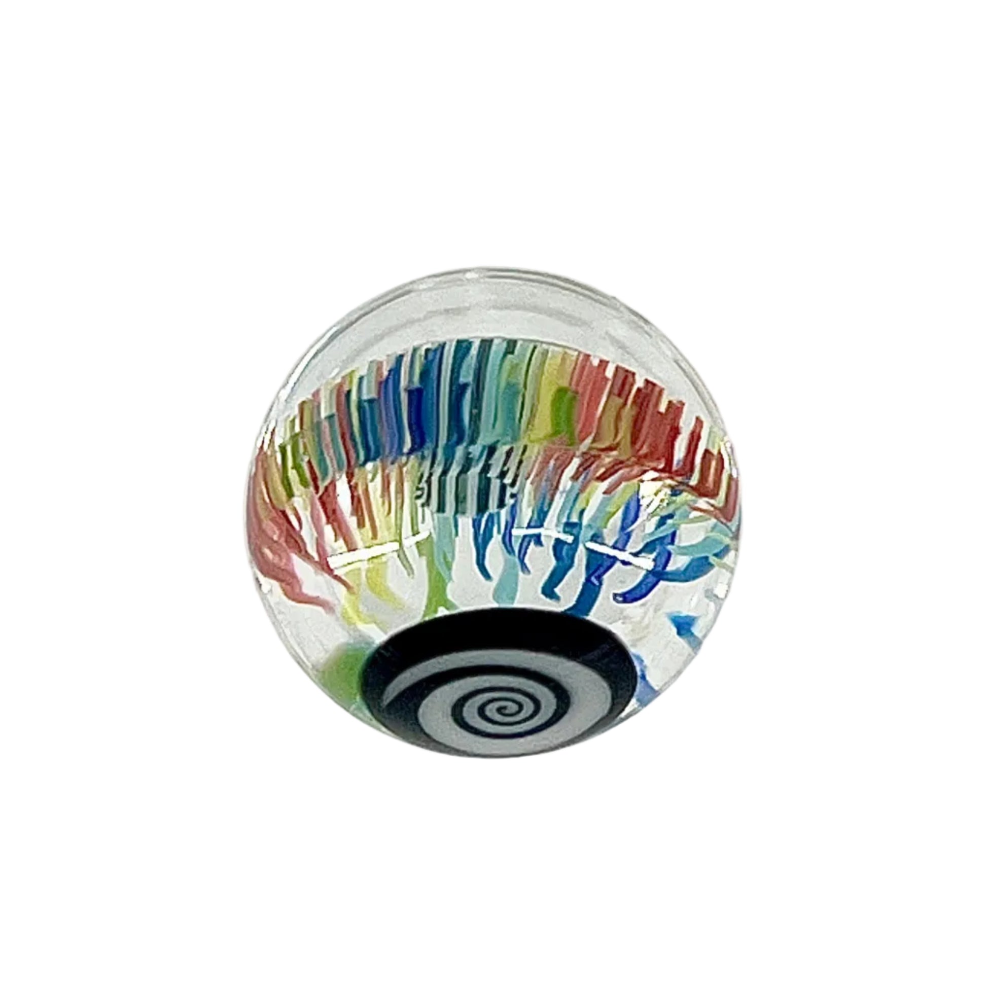 Colorful glass paperweight with a spiral design on a white background.