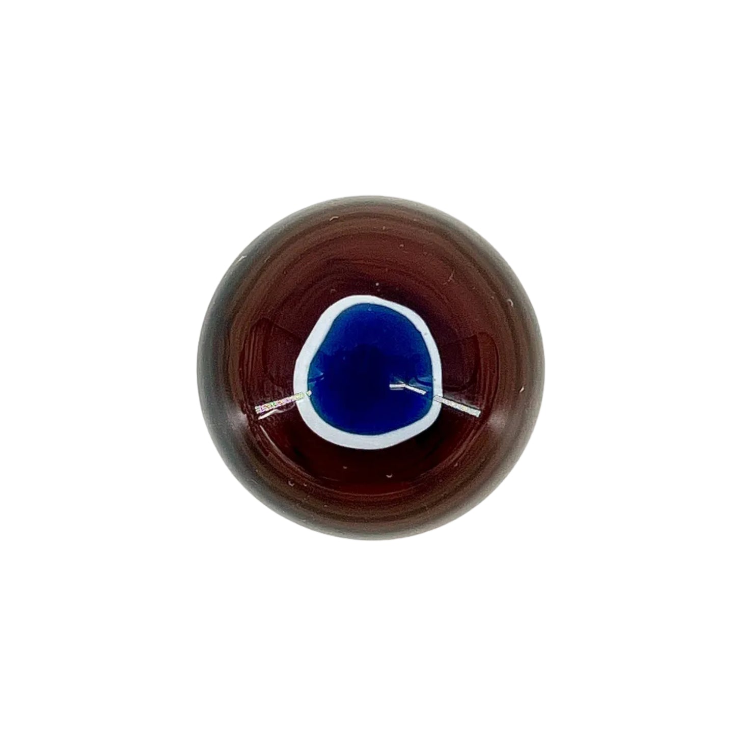 Round brown object with a blue center on a white background.