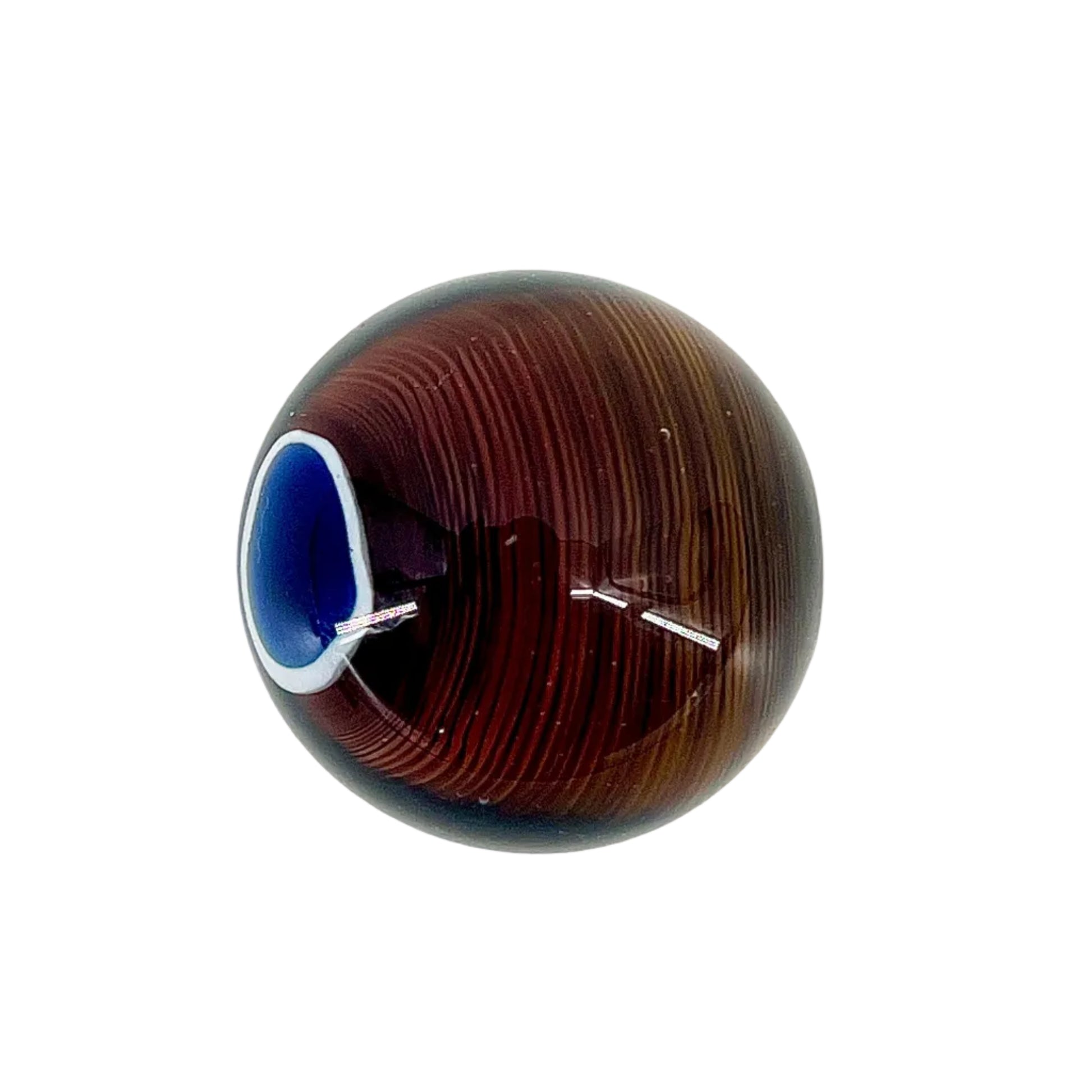 Glass sphere with brown and blue pattern on a white background.