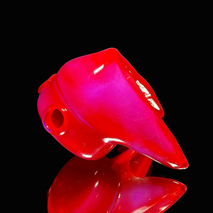 Glass pendant on a black background.