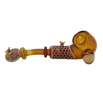 Glass pipe with honeycomb design on a white background.