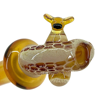 Glass smoking accessory with honeycomb pattern on a white background.