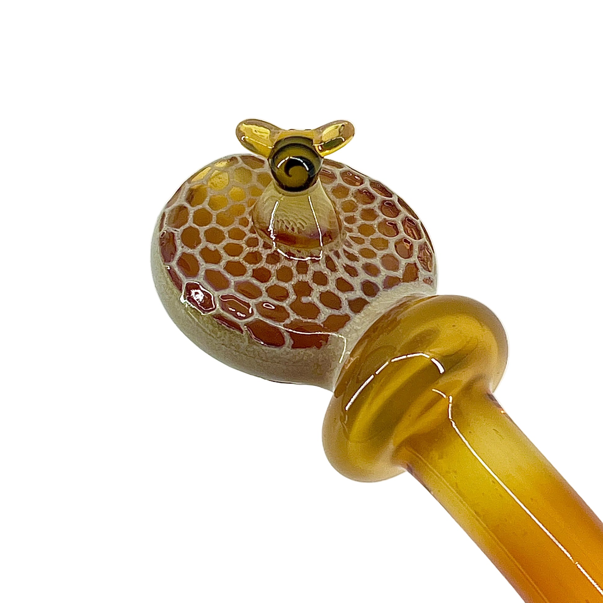 Glass pipe with honeycomb design on a white background.