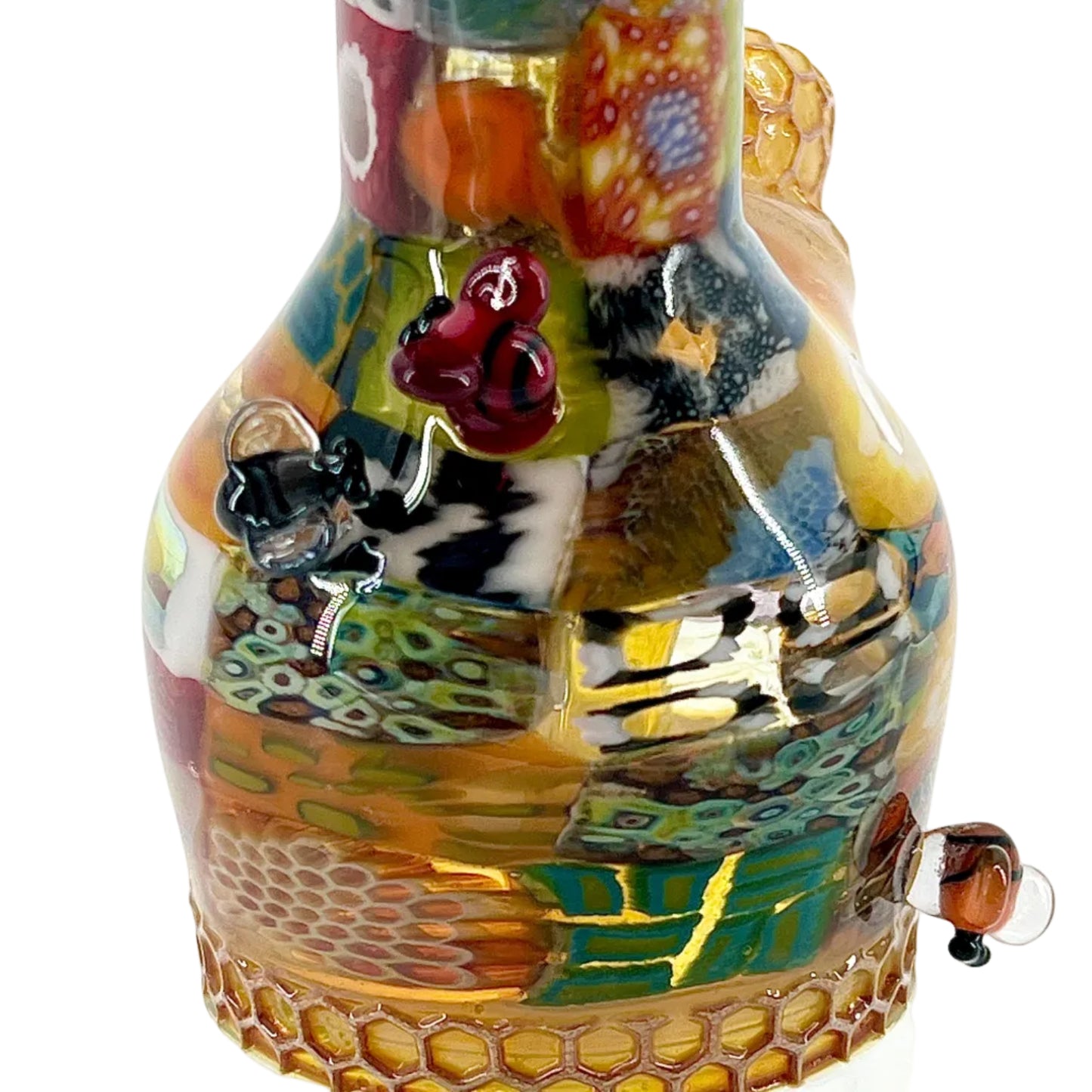 Colorful glass sculpture with intricate designs on a white background.