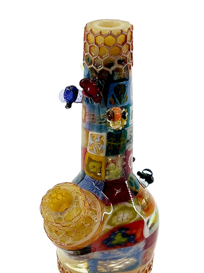 Colorful glass pipe with intricate designs on a white background.