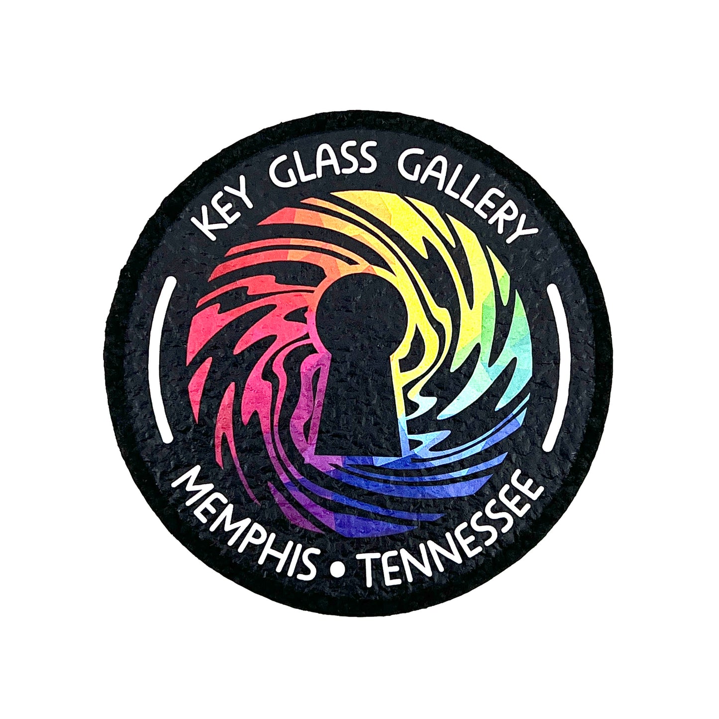 A round mat with a geometric design featuring a key and the text 'Key Glass Gallery Memphis, TN'.