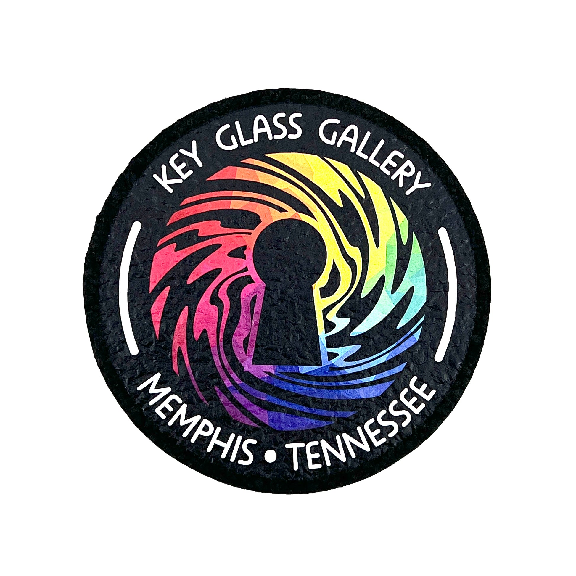 A round mat with a geometric design featuring a key and the text 'Key Glass Gallery Memphis, TN'.