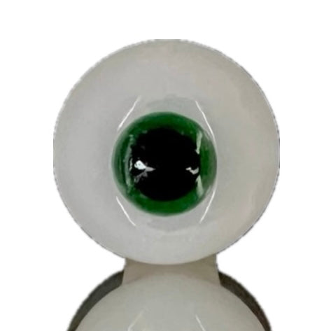 A close-up of a green glass eyeball stopper with a white exterior.
