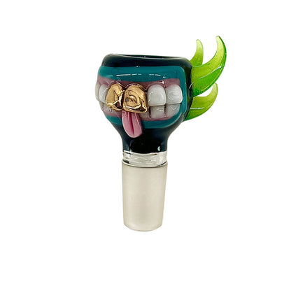 Sculpted glass slide with a face design on a white background.