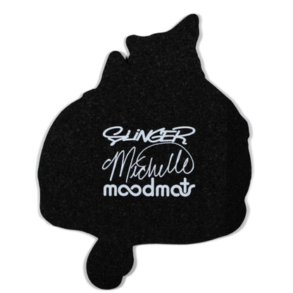 A decorative moodmat featuring a design with two cartoon cats and a colorful object.