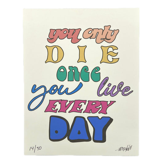 A colorful print with the text 'you only DIE once you live EVERY DAY' in various fonts and colors on a white background, indicating a motivational or inspirational message.