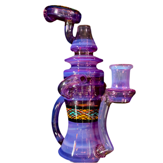 A multicolored glass piece with purple, pink, and yellow hues, featuring intricate designs and a small glass attachment.