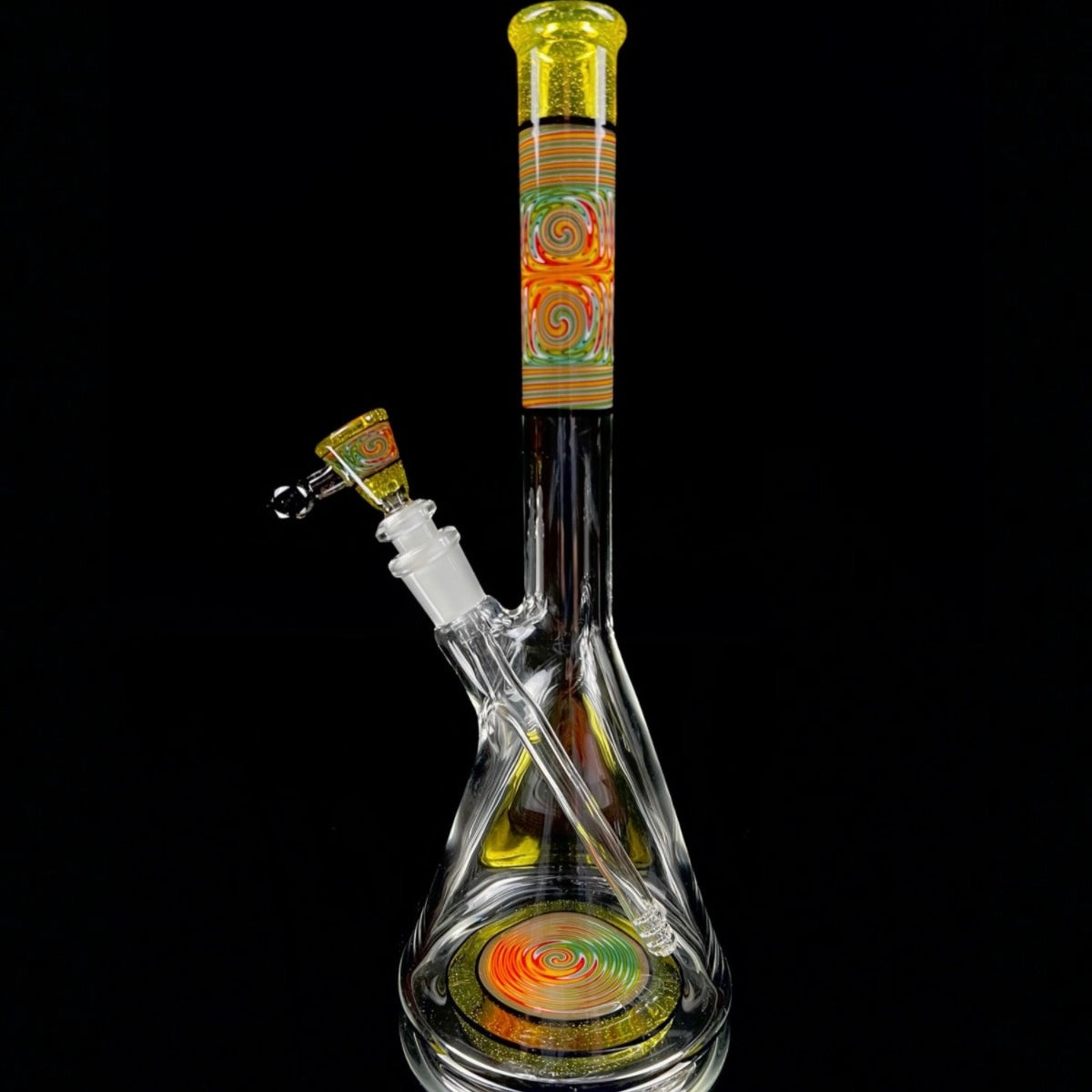 A tall, colorful glass beaker with a removable down stem and a 3-hole slide. The neck and base of the beaker feature hand-pulled lined tubing, and the piece is accented with the CFL reactive color 'Terps'.