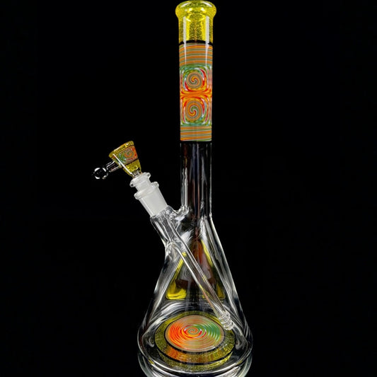 A tall, colorful glass beaker with a removable down stem and a 3-hole slide. The neck and base of the beaker feature hand-pulled lined tubing, and the piece is accented with the CFL reactive color 'Terps'.