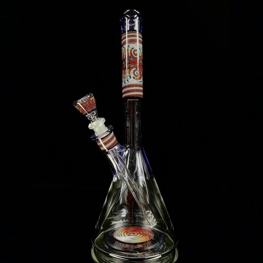 A tall, colorful beaker-shaped glass pipe with a patterned neck and base, and a removable slide.