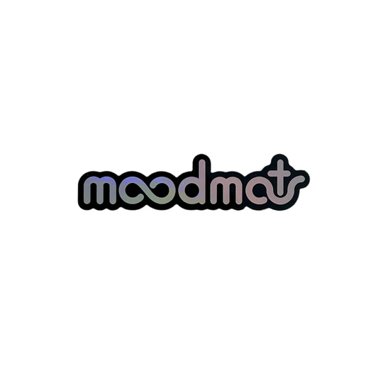Holographic 'moodmat' sticker on a white background.