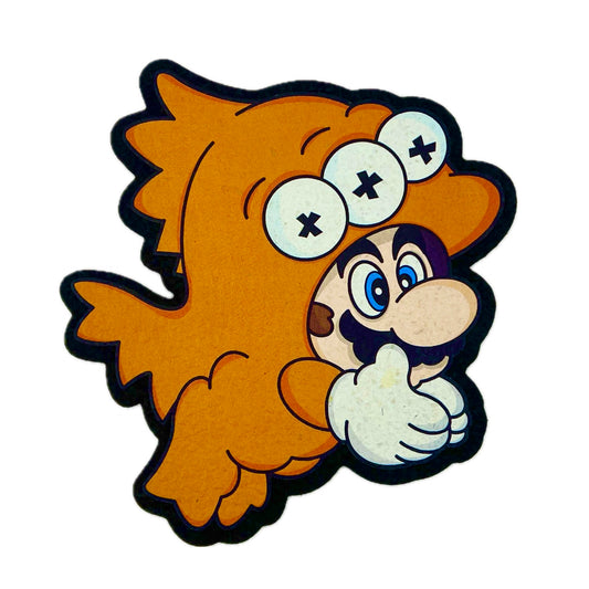 A colorful mouse pad featuring a cartoon character with a orange fish costume and multiple eyes.