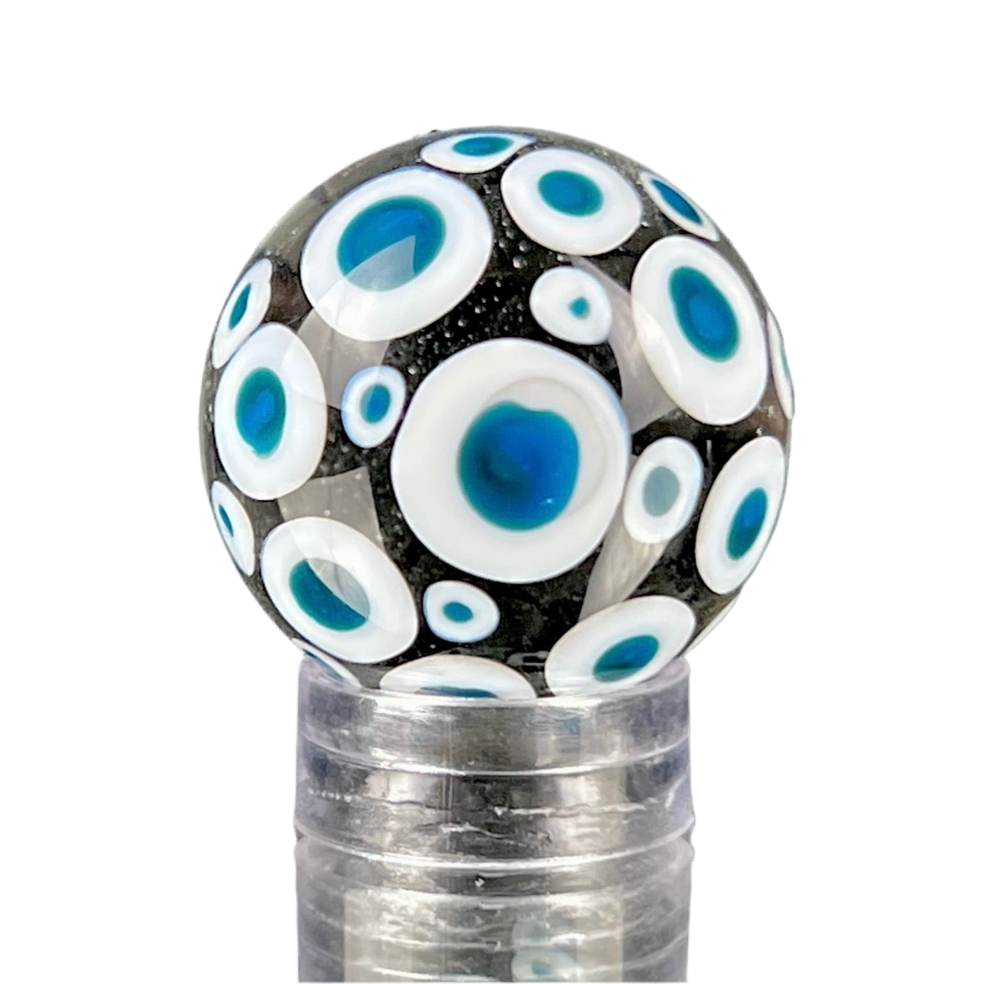 A glass marble with a design of blue dots on a white background, approximately 26mm in diameter.