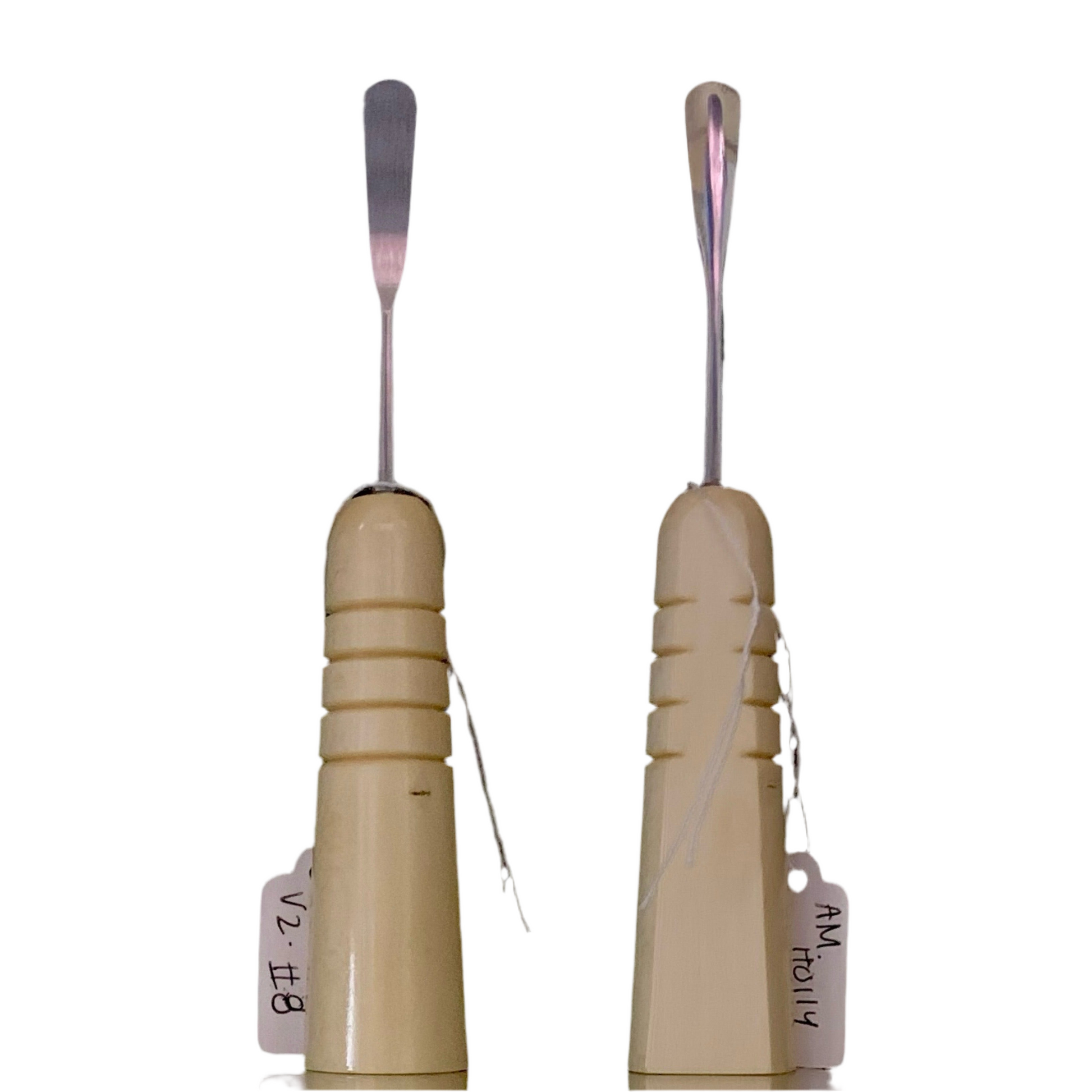 Two American holly V2 dabbers with beige handles and metal parts, displayed side by side.