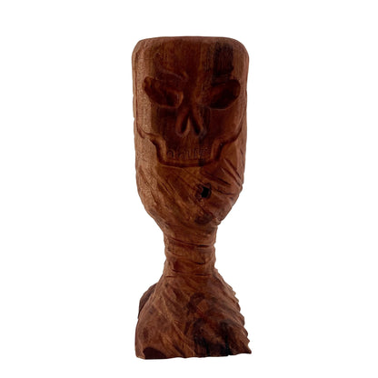 Wooden chalice with skull engraved.