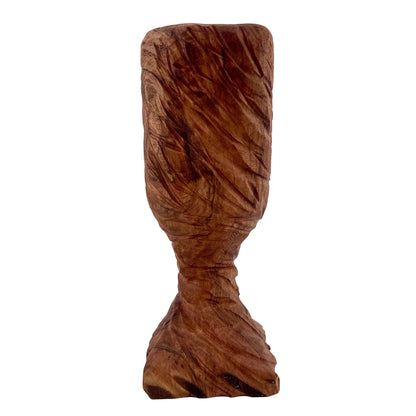 Wooden chalice with a twisted form on a white background.
