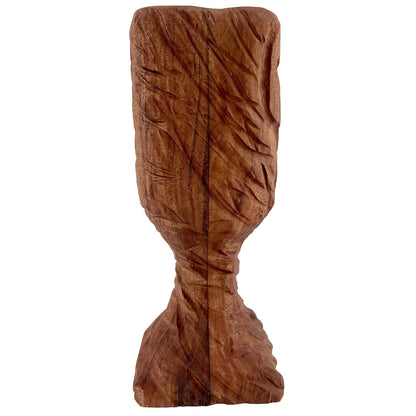 Wooden chalice with carvings on a white background.