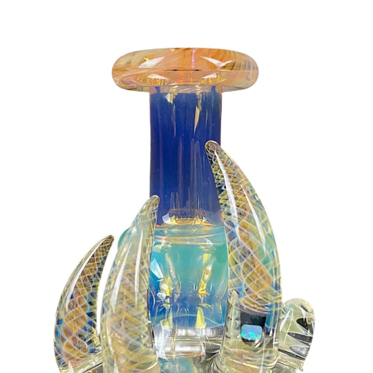 A colorful glass piece with a clear body and fumed base, featuring a 2-hole diffuser and opal-like decoration on the neck.