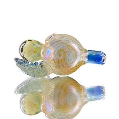 A colorful glass bubble cap with blue and yellow hues, reflecting on a smooth surface.