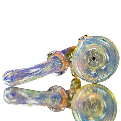 A colorful glass pipe with a double layer fume effect, featuring a small-pack bowl and a signed bottom by Phase Glass.