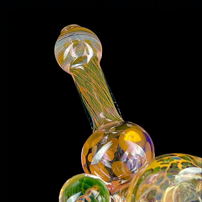A multicolored glass hammer-style pipe with intricate patterns and a round bowl.