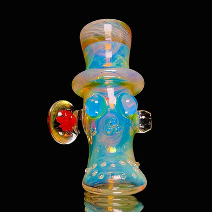 Colorful glass smoking accessory with a black background.