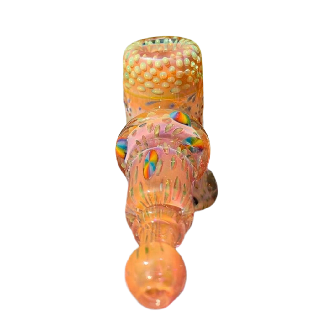 Decorative glass object with multicolored patterns on a white background.
