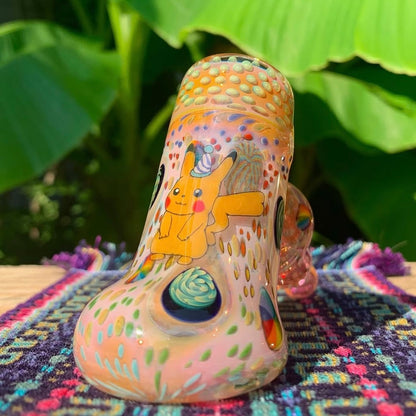 Colorful glass pipe with cartoon character on a multicolored background.