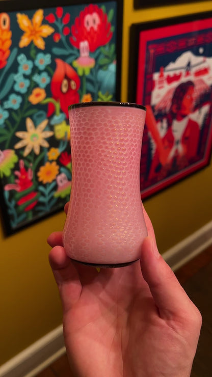 Video of a pink cup in a hand showing all sides of the cup.