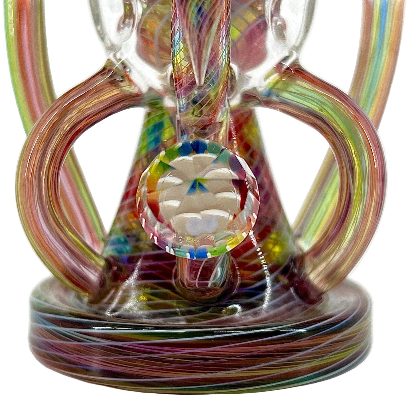Colorful glass sculpture with a central round piece on a white background
